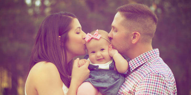 Two Guardians Kissing a Baby at the Same Time, Corona Estate Planning Attorney.