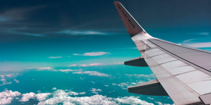 Airplane Wing at Flight. Bequeath Your Frequent Flyer Miles with An Estate Planning Attorney.