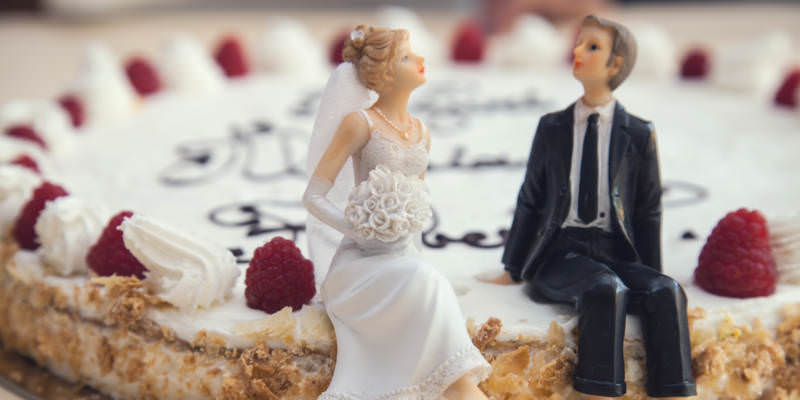 A Newlyweds Cake With Porcelain Bride and Husband Figurine, Joint Tenancy.