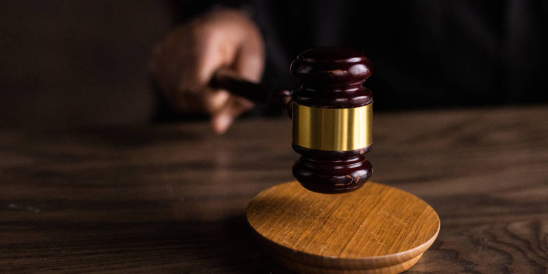 A Judge Holding a Brown Gavel After Supreme Court Rules State Medicaid Programs Can Recoup a Larger Share of Injury Settlements